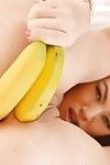 Sexy angel Tiffany Doll toying her hairy cunt with a banana