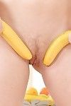 Sexy angel Tiffany Doll toying her hairy cunt with a banana