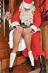 Lively golden-haired Nikky Thorne in sexy uniform gets her asshole dug by Santa