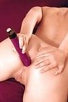 Filthy redhead Claudia Rossi strips black panty to pump her butthole by purple dildo.