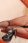 Wet blonde Riley Evans in black fishnet body stocking and shoes gets her ass screwed by big penis