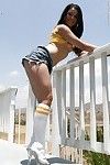 Young year old brown hair gal Amy Starz strutting outdoors in sports socks