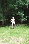 Blond placid bitch playing nude in the forest