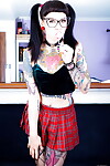 Tattooed Necro Nicki in pigtails & petticoat on knees showing firm a-hole
