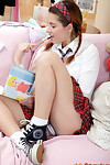 Attractive schoolgirl with her hair in pigtails toys her anus although wanking