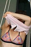 Teen Japanese model slipping off strings outdoors to reveal wavy cage of love