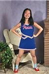 Eastern juvenile Ivy shedding cheerleader uniform for curly vagina exposure