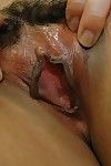 Energetic eastern lady undressing and exposing her damp gentile in close up