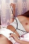 Perspired Thai teenager pulls underclothes aside to wank her unshaved fur pie