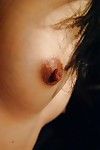 Eastern infant Hinako Muroya undressing and exposing her goods in close up