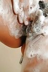 Cute eastern beauty Natsuko Miyamoto toying her curly gentile exactly after bath
