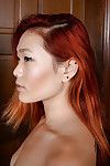 Teen redheaded Chinese cutie Lea Hart revealing skillful titties and skinhead snatch