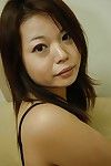 Eastern MILF Mami Isoyama undressing and stretching her underneath lips in close up