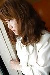 Heavy Japanese MILF with curly bawdy cleft Kyoko Nakano undressing on the mattress