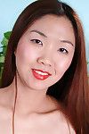 Close up posing of an infant Oriental youthful Heidi Ho in high heels