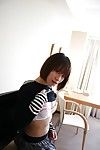 Lively oriental juvenile Chinatsu Minami undressing and posing undressed on the daybed
