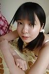 Shy oriental youthful striptease down and showcasing her gash in close up
