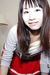 Smiley oriental youthful Miyuki Itou undressing and expposing her cum-hole in close up