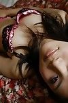 Oriental adolescent Etsuko Hatanaka undressing and exposing her gentile in close up