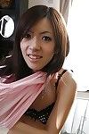 Oriental young Harumi Matsuda undressing and exposing her babe pot