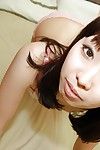 Oriental amateur Misato Uemoto undressing and exposing her juicy furry fur pie