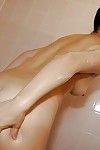 Smiley Japanese juvenile with heavy boob points winning baths and caressing she\'s