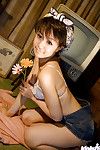 Charming Chinese amateur beauty Nana Nanami uncovering her delightful bows