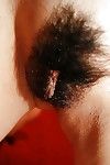 Chinese lady Asami Usui undressing and exposing her curly cage of love in close up