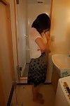 Eastern MILF Haruko Ogura takes her clothes off down and gains owned intense afterwards shower-room