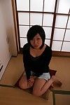 Japanese MILF Naomi Matubara undressing and amplifying her legs