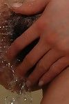Chinese MILF entrancing bath and rubbing her shaggy cunt in close up