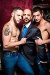 Sugar Daddy Adam Russo doles out cash to Wolf Hudson as they\'re setting the mood and getting ready for a night of drink, cash and kink, featuring 3 sided debauchery. Currency flies as JD Phoenix dances for Adam, shaking his tight wazoo in his blue and whi