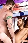 Aleks Buldocek and Shawn Wolfe eye each other in the shady light of a twink wand nestled in the woods. They are shirtless, and both have torsos covered with hair. Their hands grope and squeeze their crotches in anticipation of it\'s evident each boy has a 