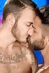 Christian Wilde and Adam Ramzi are lying bare on a couch making out, their legs entangled. Adam is masturbating Christian\'s shlong whereas Christian reaches for the fissure between Adam\'s hairy legs. Both males have full beards and hairy torsos. Adam\'s li