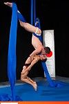 Professional aerialist Dylan Knight shows off his skills on the silks to an keen Armond Rizzo. Knight rises into the air and flips upside down then pulls Rizzo up to join him in a death-defying embrace 10 feet off the ground. The dualistic infant gymnasts