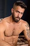 Caleb Slaver and Adam Ramzi sit naked, making out and jacking each other's hard dicks. Caleb asks for for more every time Adam teases his pierced nipples. Both studs are merely the right amount of furry, slim and athletic. Caleb eagerly services Adam's pe