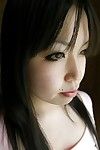 Oriental beauty Fumika Murase undressing and showcasing her sodden gash in close up