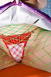 Japanese cutie Haruka Yagami lowering her fishnet hose and underclothing