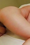 Japanese lady Akiko Kano undressing and exposing her trimmed gash in close up