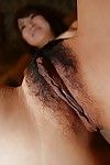 Oriental lady Asami Usui undressing and exposing her unshaved fur pie in close up