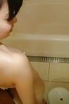 Chinese lassie gives a soapy hand and facefucking in the washroom