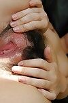 Japanese infant angel delightsome off her underclothing and teasing her hirsute gash in close up