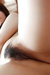Eastern adolescent Shiori Shimizu undressing and exposing her  wet crack on the sofa