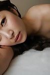 Eastern youthful Yuma Yoneyama undressing and expanding her underside lips in close up