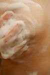Boobsy Chinese MILF admirable bathroom and rubbing her soapy cage of love in close up