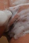 Heavy Japanese MILF with saggy meatballs takes bathroom and teases her hirsute twat