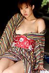 Loveable Japanese doll Adusa Kyono uncovering her mini melons