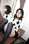 Lusty Chinese MILF in glasses takes off her strings and vibes her curly gash