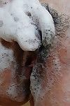 Nasty eastern MILF rubbing her soapy bends over in the baths