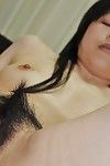 Sexual eastern MILF Yasuko Haraguchi vibing her curly cage of love subsequently shower-room